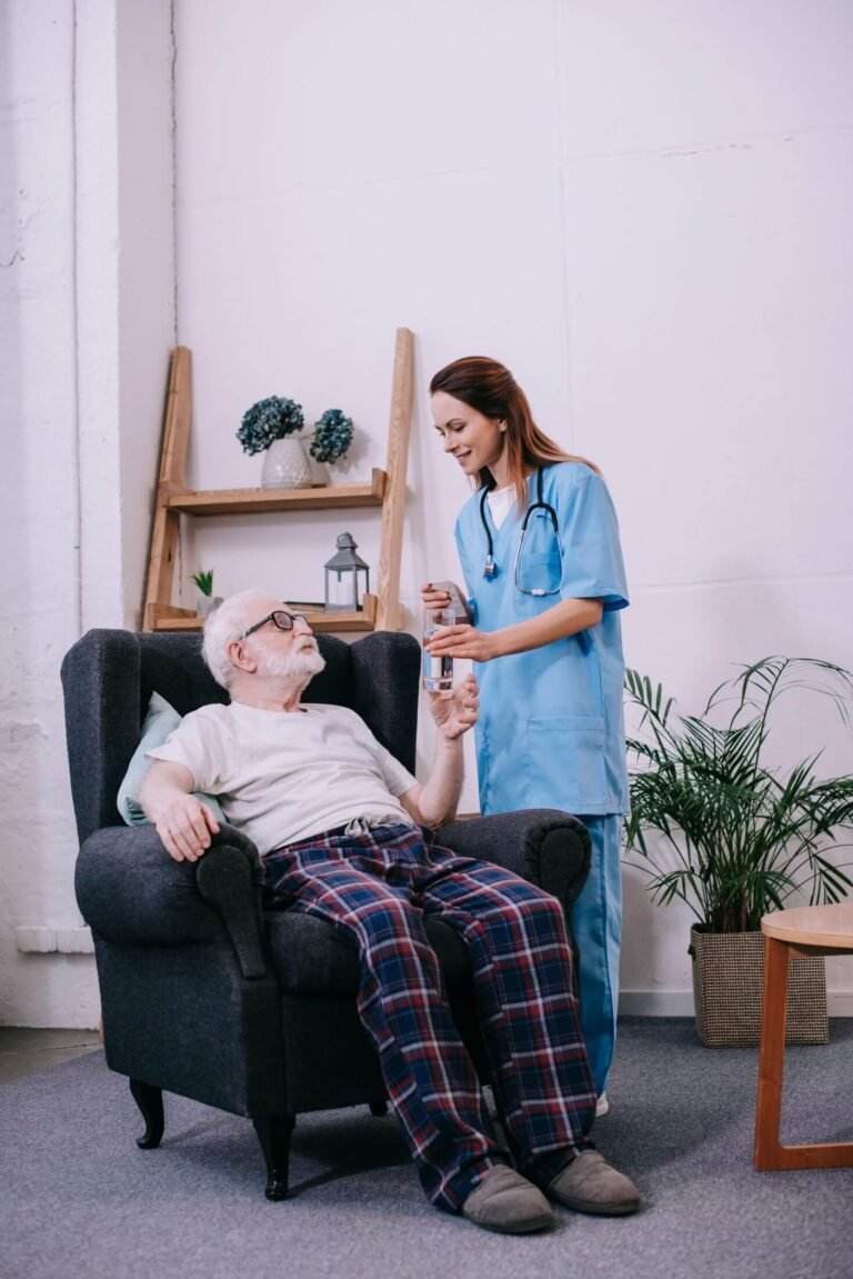 nurse giving old man a glass of water 2024 11 09 09 09 51 utc.jpg